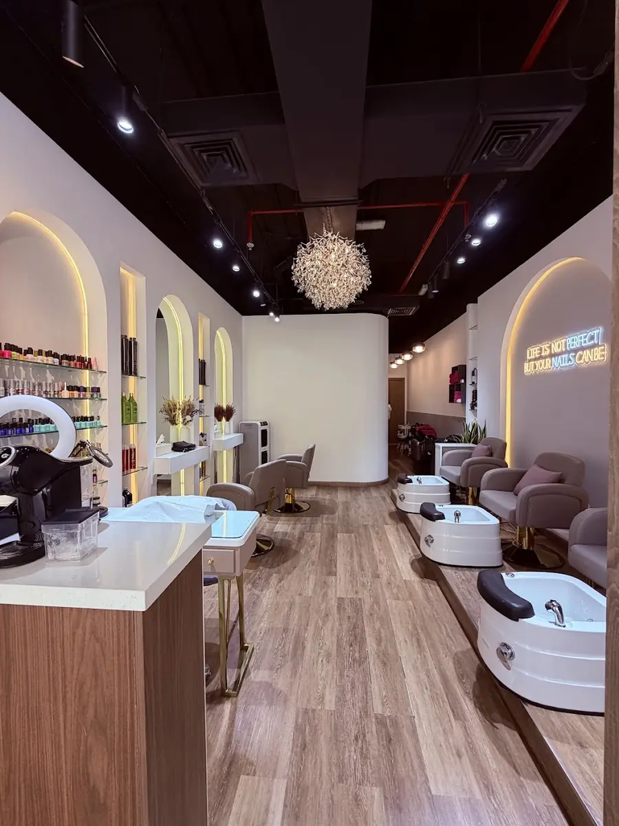 Inside Ash Beauty: the nail bar with lit arches, pedicure chairs and chandelier
